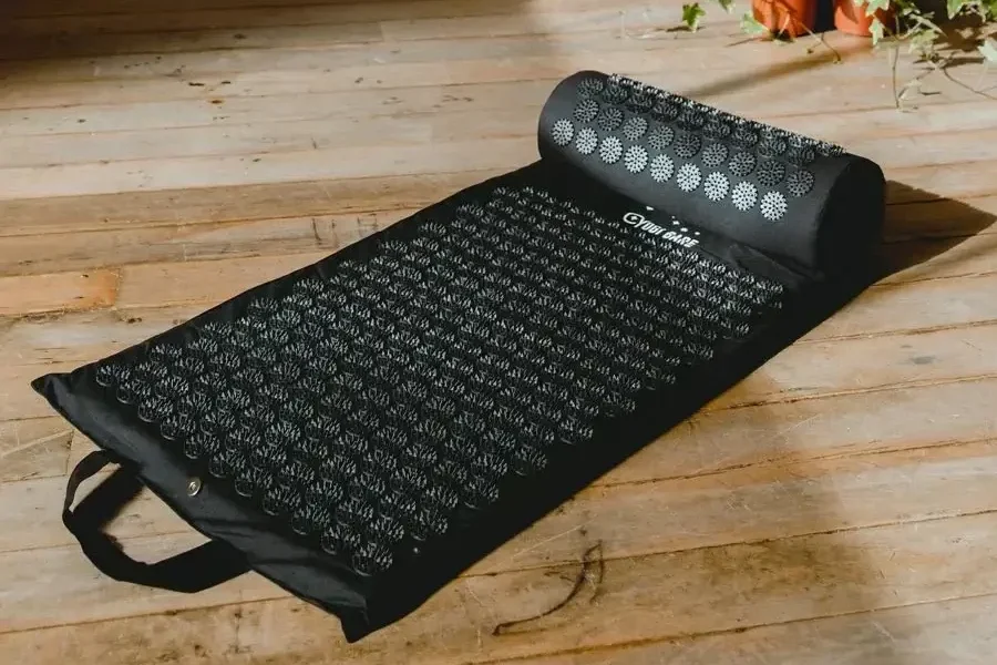 an acupressure mat laid out on the ground