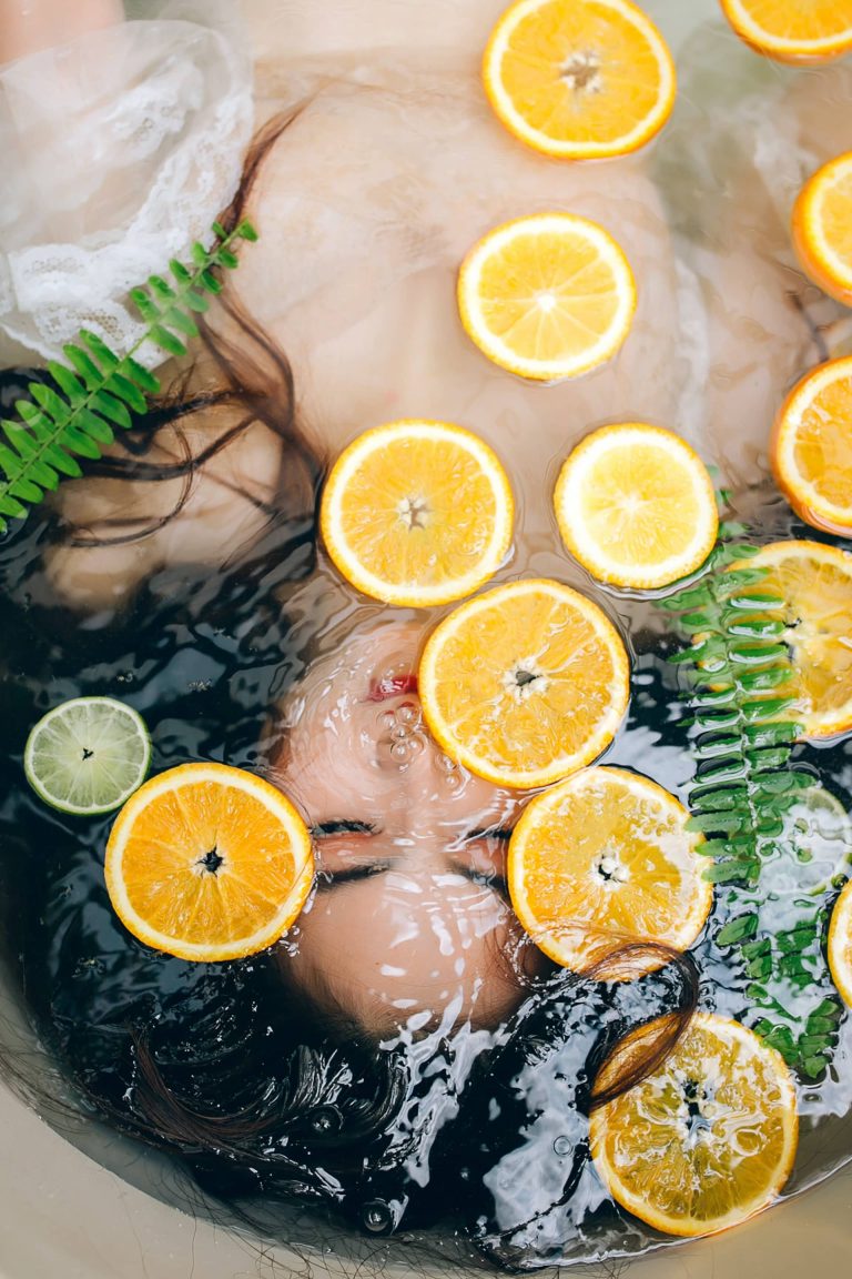 woman in a bath with lemon slices