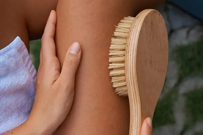 dry brushing a leg
