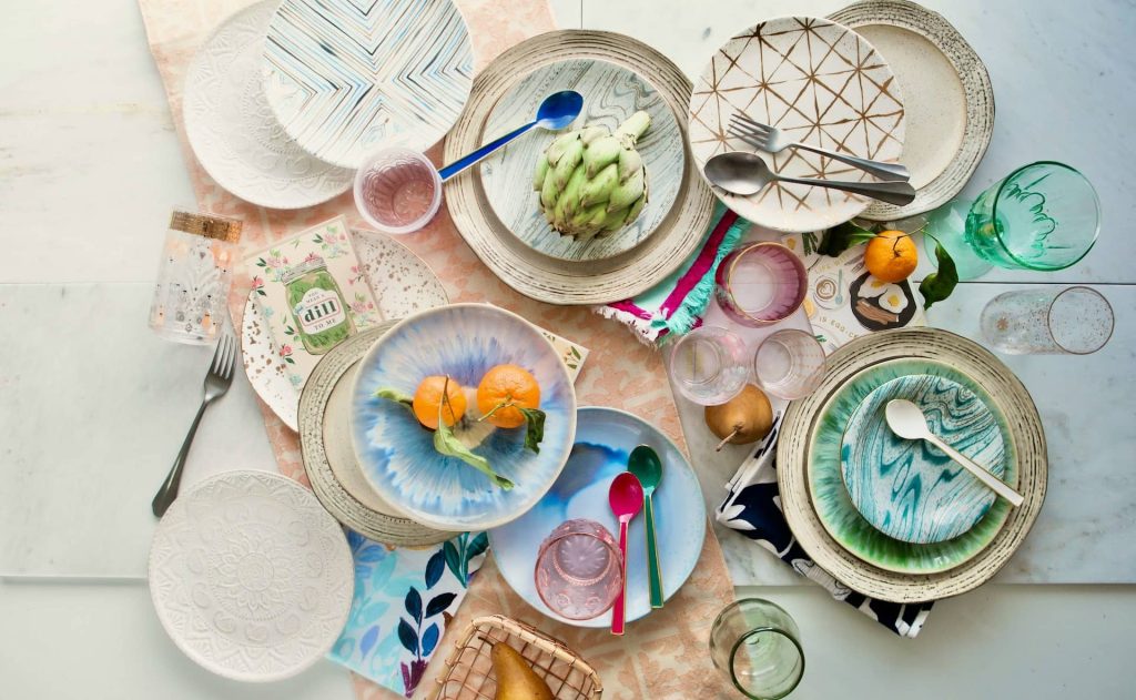 An layout of clean non toxic dinnerware on a kitchen table