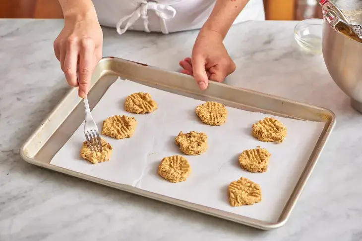 Baking cookies on a sheet of parchment paper