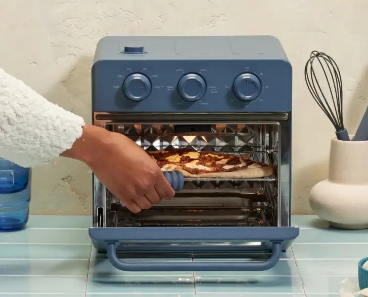 Placing food in the wonder oven air fryer