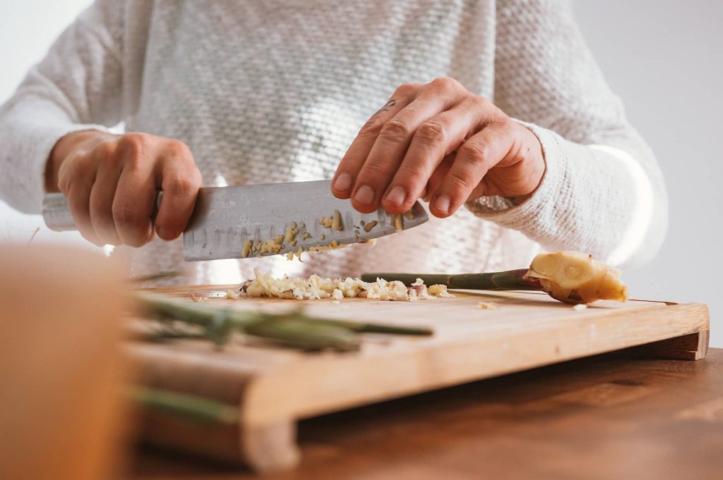 chopping vegetables on a wood nontoxic cutting board