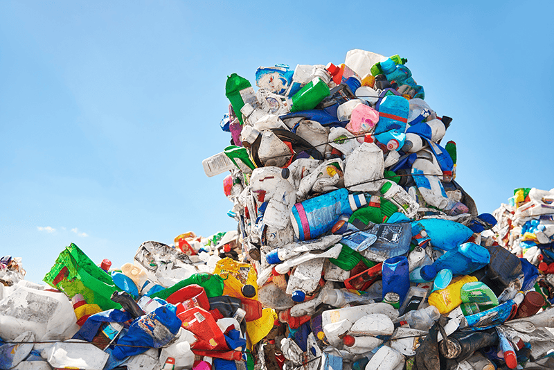 plastic laundry detergent bottles in landfill